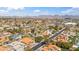 Expansive aerial view of a suburban neighborhood, showing rooftops and tree-lined streets at 6164 E Greenway Ln, Scottsdale, AZ 85254