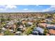 High-angle view capturing a broad residential area, scattered with green trees and manicured lawns at 6164 E Greenway Ln, Scottsdale, AZ 85254