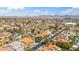 Expansive aerial view of a suburban neighborhood, showing rooftops and tree-lined streets at 6164 E Greenway Ln, Scottsdale, AZ 85254