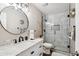 Modern bathroom features a glass-enclosed shower and marble countertop vanity at 6164 E Greenway Ln, Scottsdale, AZ 85254