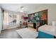 Bright Bedroom with crib, glider, and colorful decor at 6164 E Greenway Ln, Scottsdale, AZ 85254