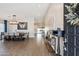 Elegant foyer featuring wood-look flooring, a dining area, and a glimpse of the kitchen at 6164 E Greenway Ln, Scottsdale, AZ 85254