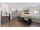 Bright game room features an air hockey table, bar area, and wood floors at 6164 E Greenway Ln, Scottsdale, AZ 85254