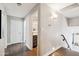 Upstairs hallway with wood floors, gray walls and a view of a bathroom at 6164 E Greenway Ln, Scottsdale, AZ 85254