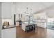 Modern kitchen with a center island, stylish pendant lighting, and stainless steel appliances at 6164 E Greenway Ln, Scottsdale, AZ 85254