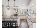 Bright kitchen featuring a center island, white cabinets, and modern pendant lighting at 6164 E Greenway Ln, Scottsdale, AZ 85254