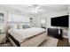 Comfortable main bedroom with ceiling fan, wood floors and lots of natural light at 6164 E Greenway Ln, Scottsdale, AZ 85254