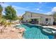 Beautiful backyard pool with rock features and landscaping create a resort-like atmosphere at 6164 E Greenway Ln, Scottsdale, AZ 85254