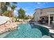 Inviting backyard pool surrounded by desert landscaping perfect for hot summer days at 6164 E Greenway Ln, Scottsdale, AZ 85254