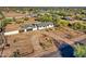 Home with detached garage and pool, surrounded by desert landscaping at 639 N 102Nd Pl, Mesa, AZ 85207