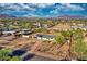 Neighborhood view showcasing desert landscape and mountain backdrop at 639 N 102Nd Pl, Mesa, AZ 85207