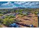 Spacious vacant lot in desert community with neighborhood homes visible at 639 N 102Nd Pl, Mesa, AZ 85207