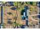 An aerial view showing the house and lot with desert landscaping in the surrounding area at 639 N 102Nd Pl, Mesa, AZ 85207