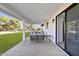 Covered patio features ample seating and a view of the lush backyard at 639 N 102Nd Pl, Mesa, AZ 85207