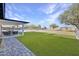 Sprawling backyard features artifical turf, swimming pool and ample room to roam at 639 N 102Nd Pl, Mesa, AZ 85207