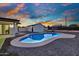 Inviting pool area with a clear blue pool, a convenient storage shed, and a well-maintained yard at 639 N 102Nd Pl, Mesa, AZ 85207