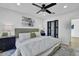 Bedroom featuring a painting, closet space, and bedside lamps at 639 N 102Nd Pl, Mesa, AZ 85207