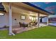 Inviting covered patio with comfortable seating, creating a relaxing outdoor living space at 639 N 102Nd Pl, Mesa, AZ 85207