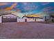 Exterior elevation of the home with garage in beautiful evening light at 639 N 102Nd Pl, Mesa, AZ 85207