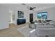 Cozy living room featuring wood-look flooring, lots of natural light, and tasteful decor and design at 639 N 102Nd Pl, Mesa, AZ 85207