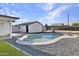 Sparkling swimming pool is surrounded by gravel and turf at 639 N 102Nd Pl, Mesa, AZ 85207