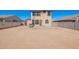 View of the backyard that features a dirt yard, concrete patio, and block wall at 6505 S 15Th Dr, Phoenix, AZ 85041
