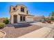 Charming two-story home with a two-car garage and low-maintenance desert landscaping at 6505 S 15Th Dr, Phoenix, AZ 85041