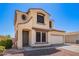 Charming two-story home with a two-car garage and low-maintenance desert landscaping in front at 6505 S 15Th Dr, Phoenix, AZ 85041