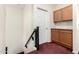 Upper-level hallway features storage cabinets and access to rooms on the second floor at 6505 S 15Th Dr, Phoenix, AZ 85041
