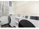 Laundry room with modern washer and dryer units at 6505 S 15Th Dr, Phoenix, AZ 85041