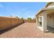 Spacious backyard with rock landscaping and a covered patio area, perfect for outdoor entertaining and relaxation at 6875 W Townley Ave, Peoria, AZ 85345