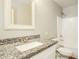 Bathroom with white vanity and granite countertop plus a shower and toilet at 6875 W Townley Ave, Peoria, AZ 85345