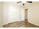 Neutral bedroom features wood flooring and double door closet at 6875 W Townley Ave, Peoria, AZ 85345