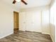Neutral bedroom features wood flooring and closet space at 6875 W Townley Ave, Peoria, AZ 85345