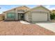 Inviting home with desert landscaping, showcasing the well-manicured front yard and inviting entrance at 6875 W Townley Ave, Peoria, AZ 85345