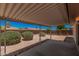 Covered patio offering a shaded outdoor living space with landscaped backyard at 916 W Loughlin Dr, Chandler, AZ 85225