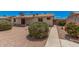 Manicured backyard features desert landscaping and a private patio at 916 W Loughlin Dr, Chandler, AZ 85225