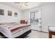 Bright bedroom featuring tile floors, neutral walls, and a ceiling fan at 916 W Loughlin Dr, Chandler, AZ 85225