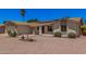 Charming single-story home with a well-maintained xeriscaped yard, solar panels, and a comfortable bench at 916 W Loughlin Dr, Chandler, AZ 85225