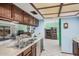 Bright kitchen with view into a Gathering room and traditional cabinetry at 916 W Loughlin Dr, Chandler, AZ 85225
