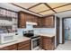 Classic kitchen with wooden cabinets, stainless appliances, and a bright ceiling at 916 W Loughlin Dr, Chandler, AZ 85225
