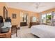 The main bedroom features tile flooring, a ceiling fan, and an ensuite bathroom at 916 W Loughlin Dr, Chandler, AZ 85225