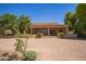 Secluded backyard with a covered patio perfect for relaxing and entertaining, with desert landscaping at 9658 W Golddust Dr, Queen Creek, AZ 85144