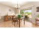 Dining room featuring tile flooring, neutral walls, a chandelier, and sliding glass doors to outdoor patio at 9658 W Golddust Dr, Queen Creek, AZ 85144