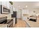 Kitchen features stainless steel appliances, countertops, and tiled floors at 9658 W Golddust Dr, Queen Creek, AZ 85144