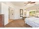 The main bedroom showcases carpeted floors and ensuite bathroom access at 9658 W Golddust Dr, Queen Creek, AZ 85144