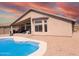 Backyard featuring a pool and an outdoor kitchen at 11424 S Obispo Dr, Goodyear, AZ 85338