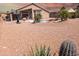 Spacious desert backyard with desert landscaping, cactus, and privacy fence at 11424 S Obispo Dr, Goodyear, AZ 85338