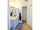 Bathroom features a single sink vanity with storage and a mirror at 11424 S Obispo Dr, Goodyear, AZ 85338