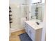 Bathroom featuring a shower and a vanity with drawers at 11424 S Obispo Dr, Goodyear, AZ 85338